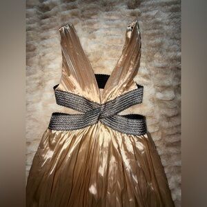 Elegant Gold Pleated Dress with Black Accents